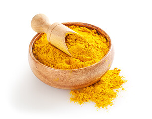 Dry turmeric (curcuma) powder in wooden bowl with scoop isolated on white background