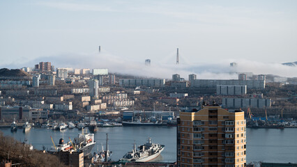 Vladivostok cityscape view. Fog over the city.