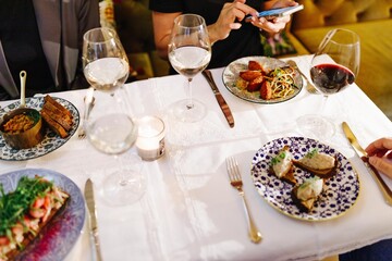 a company of people having dinner in a restaurant