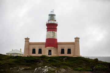Fototapeta na wymiar Cape Agulhas lighthouse divides the Atlantic Ocean and the Indian Ocean in South Africa, it is also one of the oldest lighthouses in this African country.
