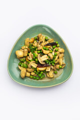 Mushroom and Pea Curry with Roasted Garlic, Indian food served in a bowl