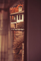 Autumn landscape, house view through the window