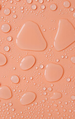 Drops of liquid, moisturizing cosmetic product. Hyaluronic acid. Selective focus.