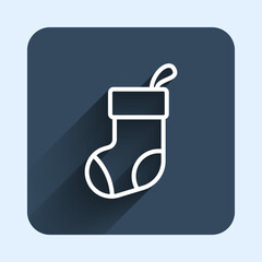 White line Christmas stocking icon isolated with long shadow background. Merry Christmas and Happy New Year. Blue square button. Vector