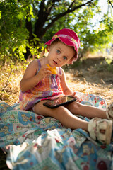 Baby girl plays in nature