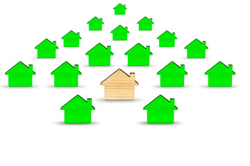 The concept of mortgage and rental housing and real estate. Mortgage credit lending. Multicolored wooden houses on a white isolated background. Banner format. Copy space.