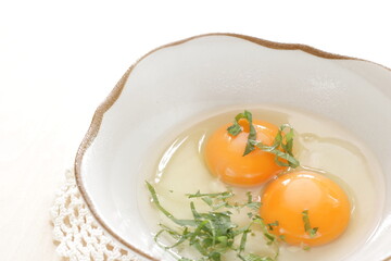Double raw egg and herbal Shiso for Japanese fried egg cooking ingredient