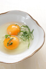 Double raw egg and herbal Shiso for Japanese fried egg cooking ingredient