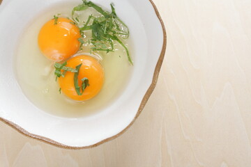 Double raw egg and herbal Shiso for Japanese fried egg cooking ingredient