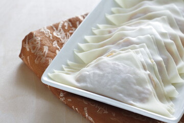 Chinese cooking, prepared triangle shape wonton on plate for prepared food ingredient