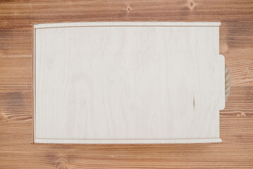 Wooden empty box on wooden background. Top view.