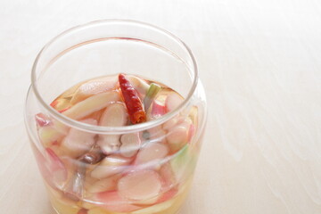 Homemade Japanese young ginger sliced and chili pepper in vinegar for pickles cooking