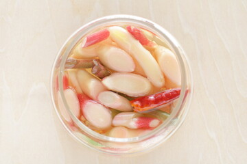 Homemade Japanese young ginger sliced and chili pepper in vinegar for pickles cooking