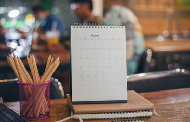 2023 Calendar desk place on the table. Desktop Calender for Planner to plan agenda, timetable, appointment, organization, management each date, month, and year on wooden office table. Calendar Concept