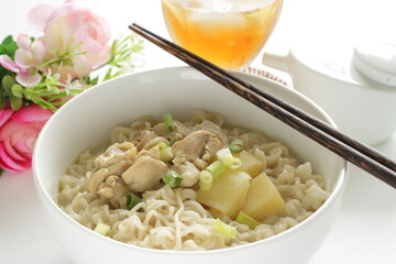 Thai fusion food, green curry ramen noodles and iced tea