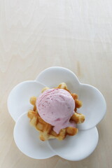 Strawberry ice-cream on Belgium waffle for dessert image