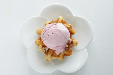 Strawberry ice-cream on Belgium waffle for dessert image
