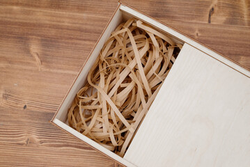 Wooden empty box on wooden background. Top view.