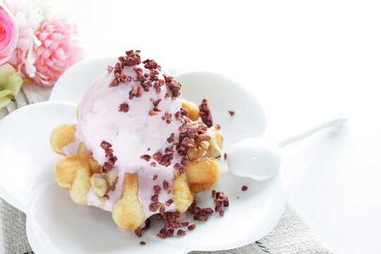 Strawberry ice-cream on Belgium waffle for dessert image