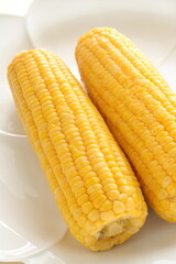 Summer boiled sweet corn, on bamboo basket for healthy food image