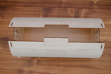Wooden empty box on wooden background. Top view.