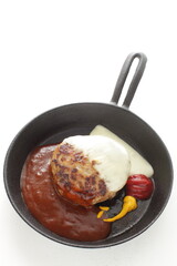 Homemade hamburger patty on skillet pan for comfort food image