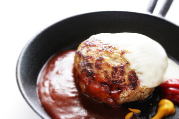 Homemade hamburger patty on skillet pan for comfort food image