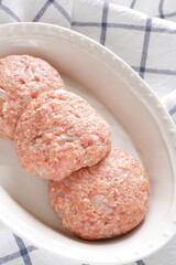 Prepared hamburger patty for cooking image