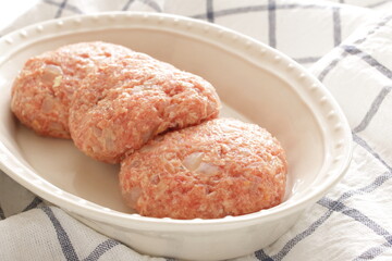 Prepared hamburger patty for cooking image