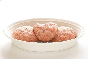 Prepared hamburger patty for cooking image