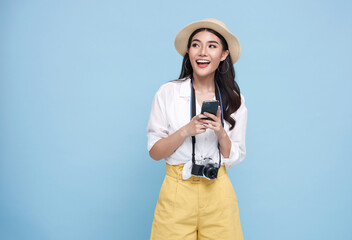 Happy young Asian tourist woman using smartphone application going to travel on holidays isolated...