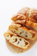 Sliced French bread on wooden board with copy space