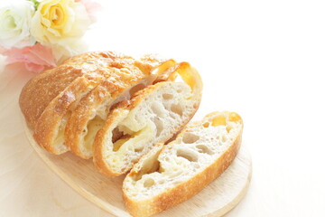Sliced French bread on wooden board with copy space