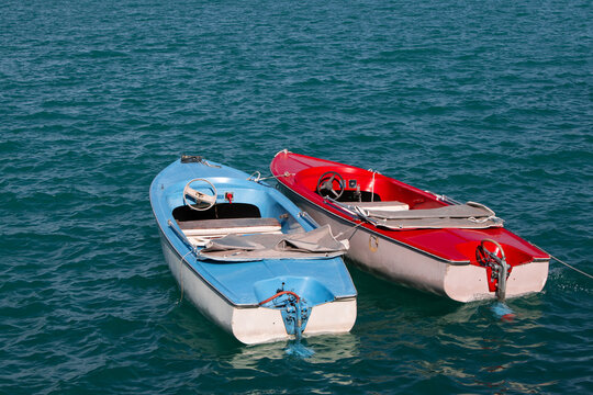 Old Two Boats, Red And Blue Boats On Lake.