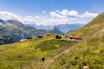 View of a very large and majestic alpine landscape in the Lord of the Rings style. In the...