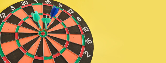 dart in a lined board for playing darts