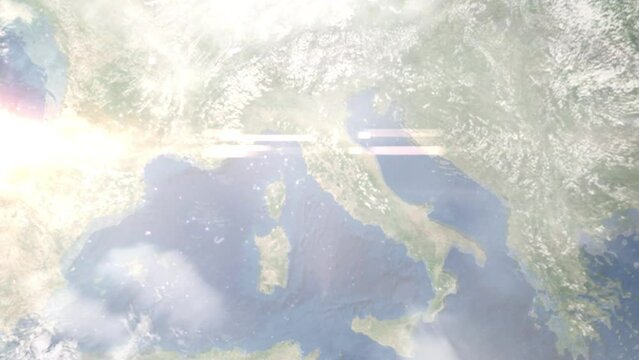 Earth zoom in from outer space to city. Zooming on Grosseto, Italy. The animation continues by zoom out through clouds and atmosphere into space. Images from NASA