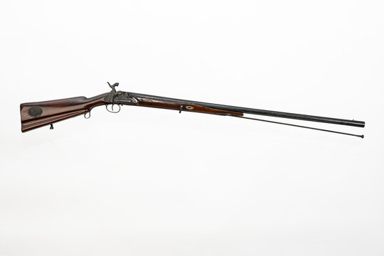 Old muzzle-loading rifle or long-barreled muzzle-loading shotgun