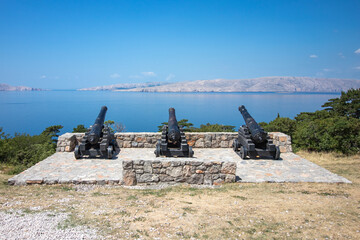 Three canons facing towards the sea in croatia.