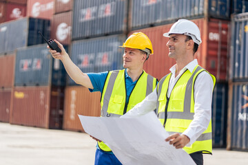 Two Caucasian business man worker working in container port terminal. 