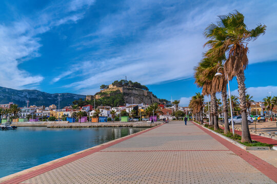 Denia Spain castle viewed from marina Alicante with colourful houses and mountain and beautiful blue sky 