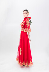 A woman in a red Traditional Chinese wedding dress