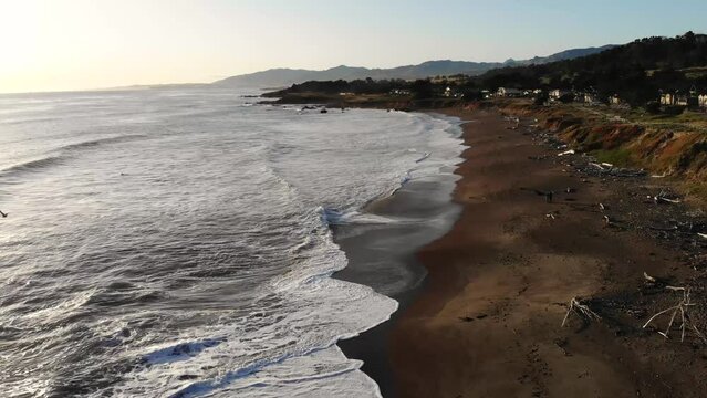 Cambria Beach at Sunset. Drone Footage of Horizon and waves crashing in. Westcoast Roadtrip at Highway One, California.