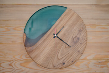 Wooden round wall clock.Round eco clock made of wood and epoxy.