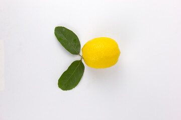 A Fresh yellow Lemon with leaves isolated on white background concept