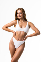 Beautiful fitness woman with a perfect body isolated on white background