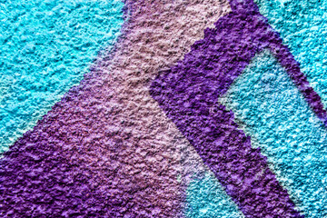 Art under ground. Beautiful street art graffiti background. The wall is decorated with abstract drawings house paint. Modern style urban culture of street youth. Abstract picture on wall