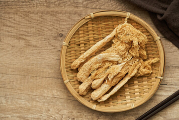 top view or flat lay dry bamboo mushroom or on bamboo fungus wooden plate on wood table background ...