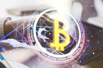Creative Bitcoin concept with finger clicks on a digital tablet on background. Multiexposure