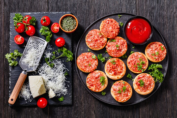 mini pizzas with ham and pecorino cheese, top view